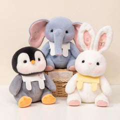 Collection of penguin, elephant, and bunny plush toys together, inviting warmth and companionship