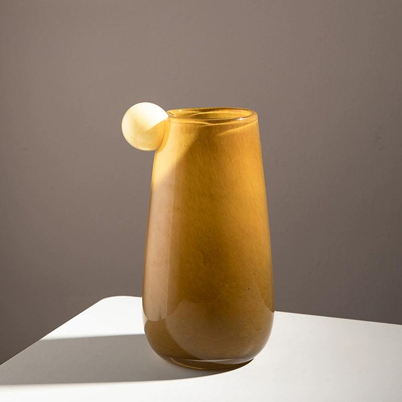 Hand-blown amber glass vase with elegant curve and unique tactile surface, ideal for adding chic ambiance to any home.