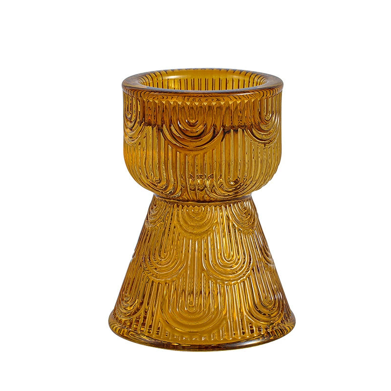 Amber-colored glass candle holder with elegant textured stripes