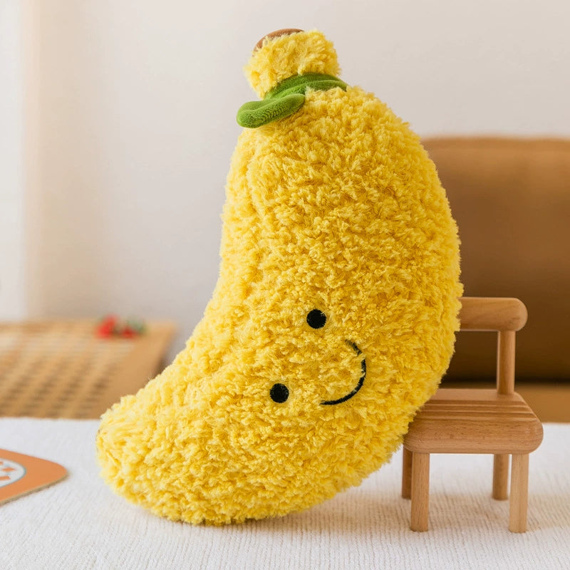 Yellow banana plush toy with slight curve and playful smile