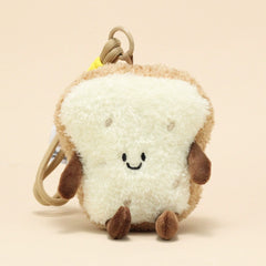 Side view of bread slice plush keychain with smiling face and brown limbs