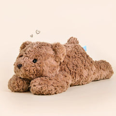 Cozy brown teddy bear plush toy in a relaxed pose on a neutral background