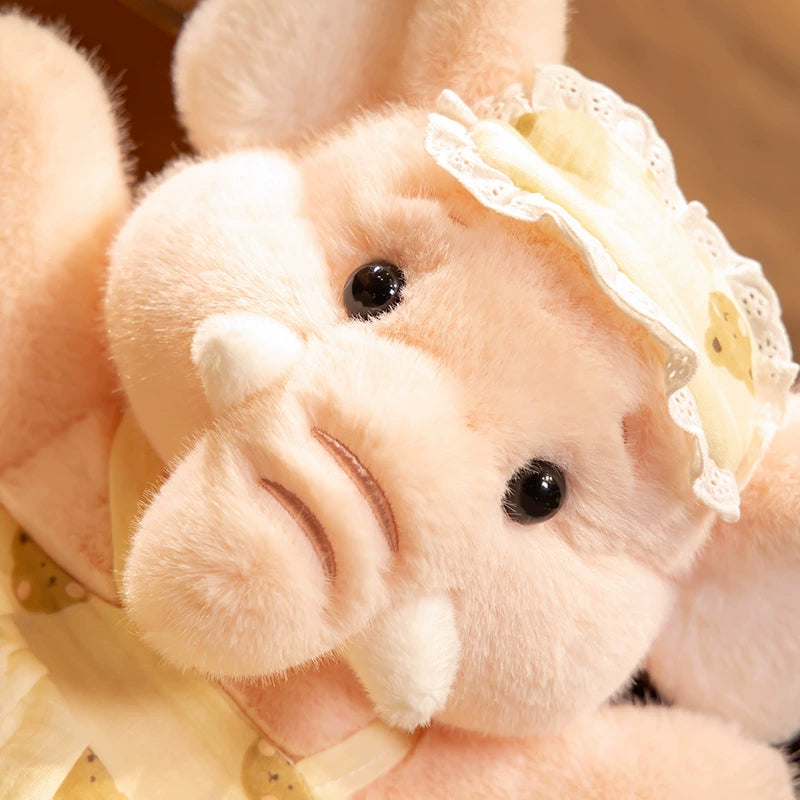 Close-up of the pink Bruce Comfort Elephant Plush showcasing soft short plush and bright, soulful eyes.