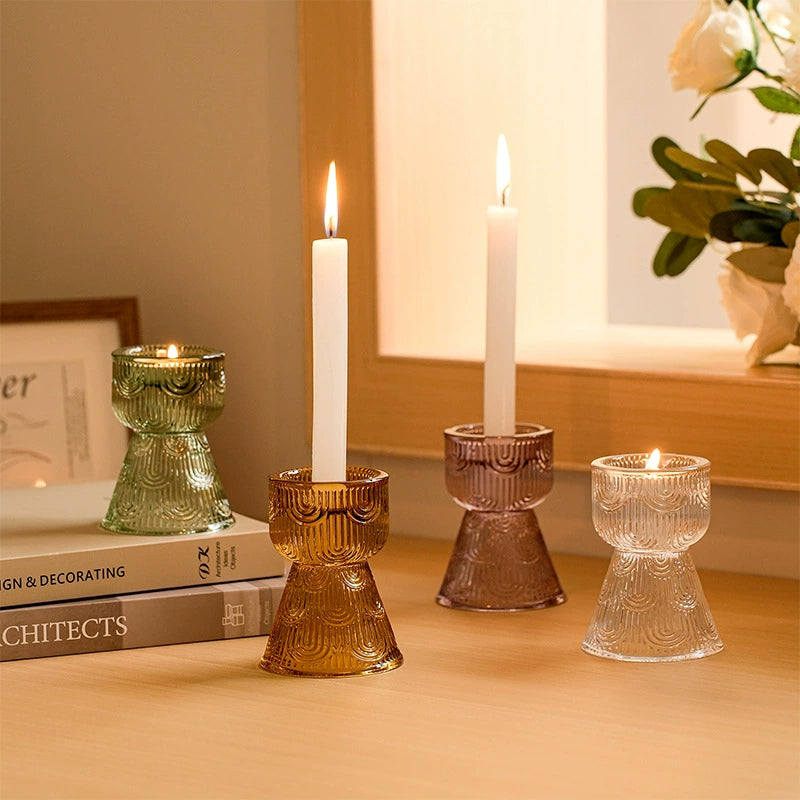 Warm home scene featuring colorful striped glass candle holders, inviting a tranquil mood