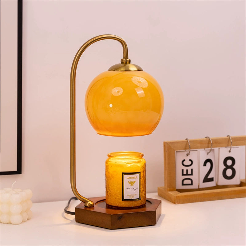 Elegant retro candle warmer lamp with amber dome, adding a warm touch to room atmosphere