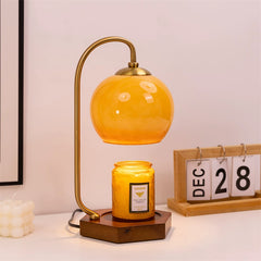Elegant retro candle warmer lamp with amber dome, adding a warm touch to room atmosphere