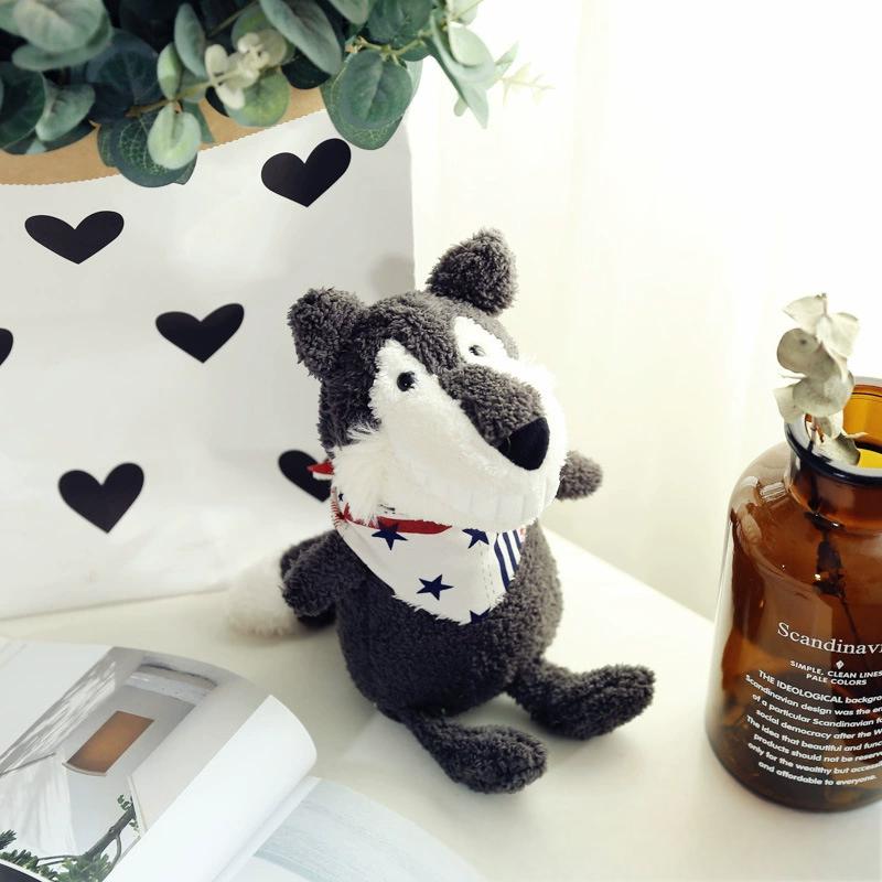  Grey wolf plush toy with a cute expression and star scarf, sporting a wide smile near a vase