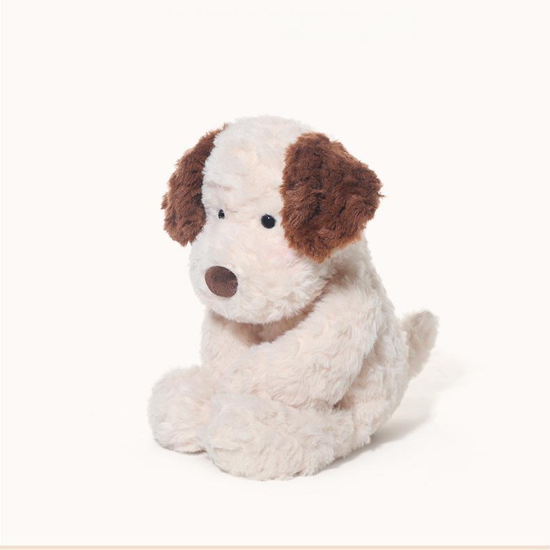 Jack the Sad Puppy Plush sitting at an angle, softly gazing forward
