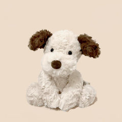 Jack the Sad Puppy Plush placed on light beige background, ready to bring comfort