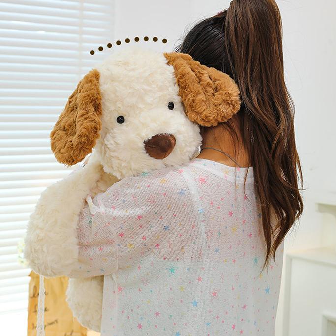 Girl hugging the large Little Dog Jack 2.0 Plush, feeling embraced and comforted