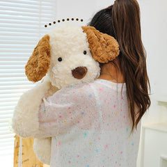 Girl hugging the large Little Dog Jack 2.0 Plush, feeling embraced and comforted