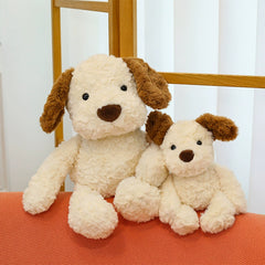 Two sizes of Little Dog Jack 2.0 Plush Toys leaning together, showing warmth and closeness