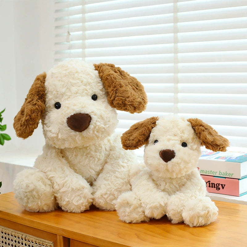 Little Dog Jack 2.0 Plush Toys in two sizes placed together on a sunny windowsill