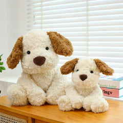 Little Dog Jack 2.0 Plush Toys in two sizes placed together on a sunny windowsill