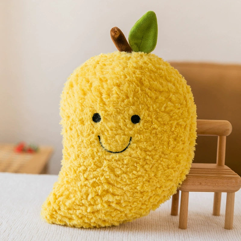 Sunny yellow mango plush toy with textured surface and cheerful smile