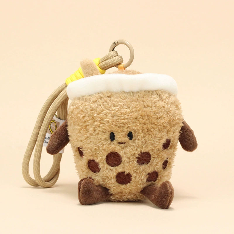 Side view of milk tea plush keychain with smiling face and boba details