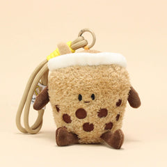Side view of milk tea plush keychain with smiling face and boba details