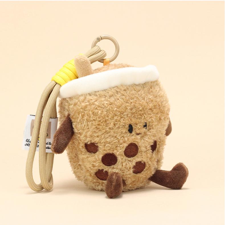 Front view of milk tea plush keychain with plush boba pearls and sweet face