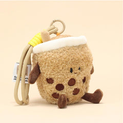 Front view of milk tea plush keychain with plush boba pearls and sweet face