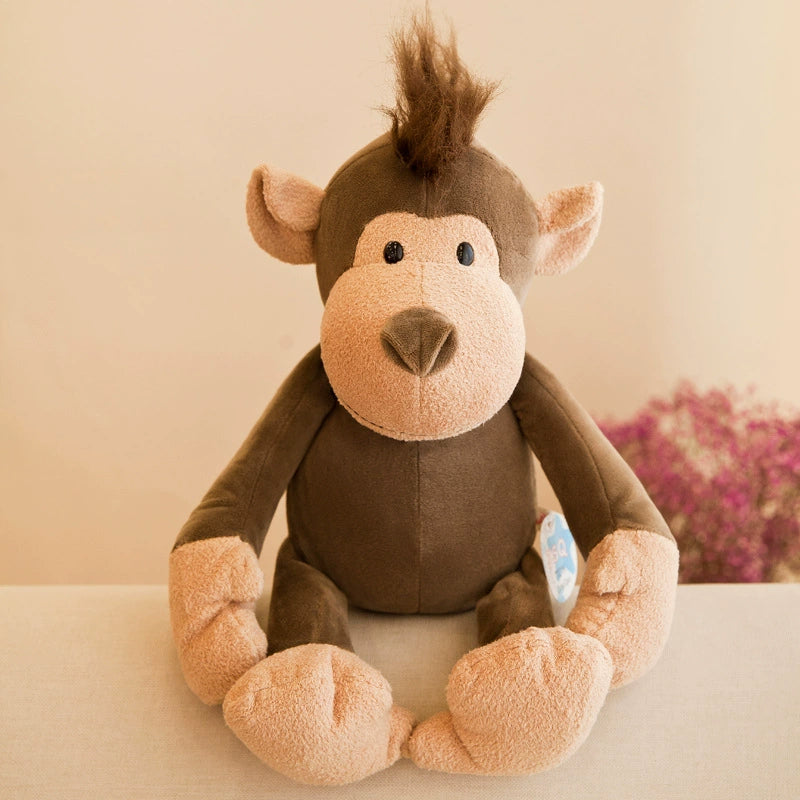Monkey plush toy with lively tuft, sitting joyously and offering whimsical comfort as Plush Toys
