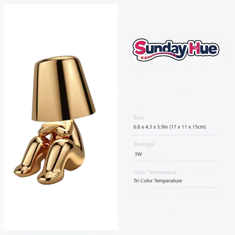 Gold Soulster Lamp in a sitting, gently musing posture; perfect for mood lighting and modern decor