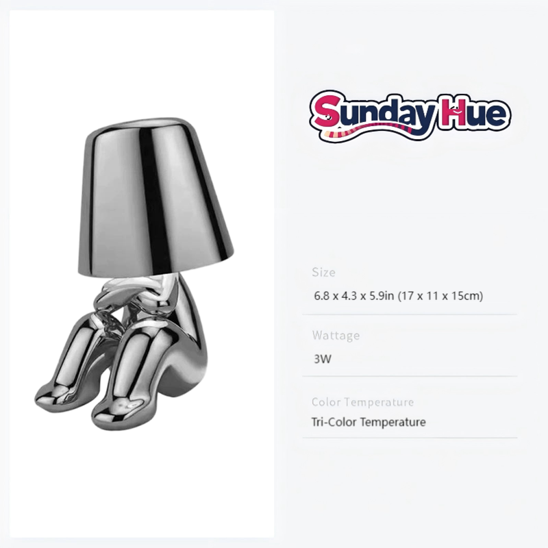 Silver Soulster Lamp in a peaceful musing seated position, creating a calming desktop ambiance