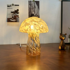 Elegant mushroom-shaped glass desk lamp radiates a soft, vintage glow, enhancing the retro interior mood.