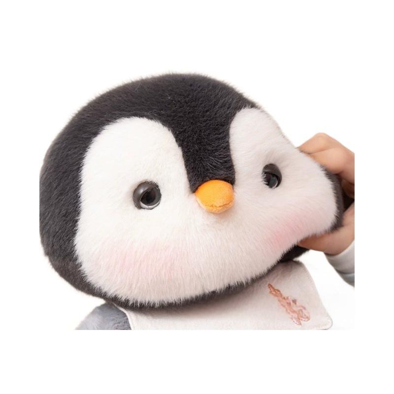 Detailed view of the penguin plush toy’s soft features and cute blush