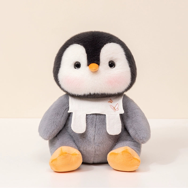 Soft penguin plush toy with embroidered bib, perfect for cuddling and gifting