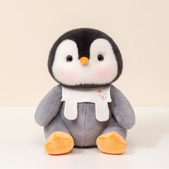 Soft penguin plush toy with embroidered bib, perfect for cuddling and gifting