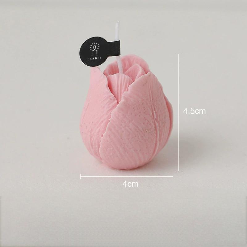 Pink tulip shaped candle upright with visible petal details and dimensions shown.