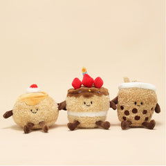 Pudding, cake, and milk tea plush keychains lined up with smiling faces