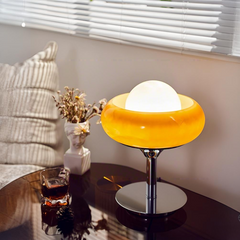 Egg tart-shaped desk lamp casting natural light in a cozy room, enhancing relaxing ambience