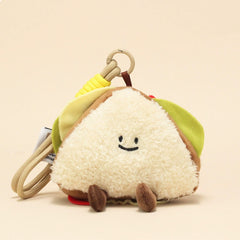 Side view of sandwich plush keychain with smiling face and colorful filling details