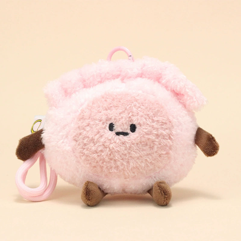 Front view of shrimp dumpling plush keychain with endearing embroidered face