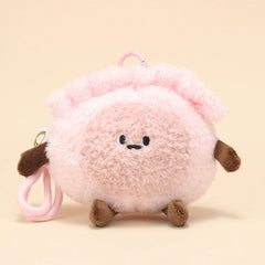 Front view of shrimp dumpling plush keychain with endearing embroidered face