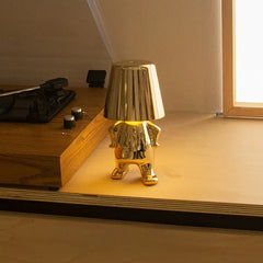 Single gold Soulster Lamp in everyday setting, radiating confidence and gentle illumination