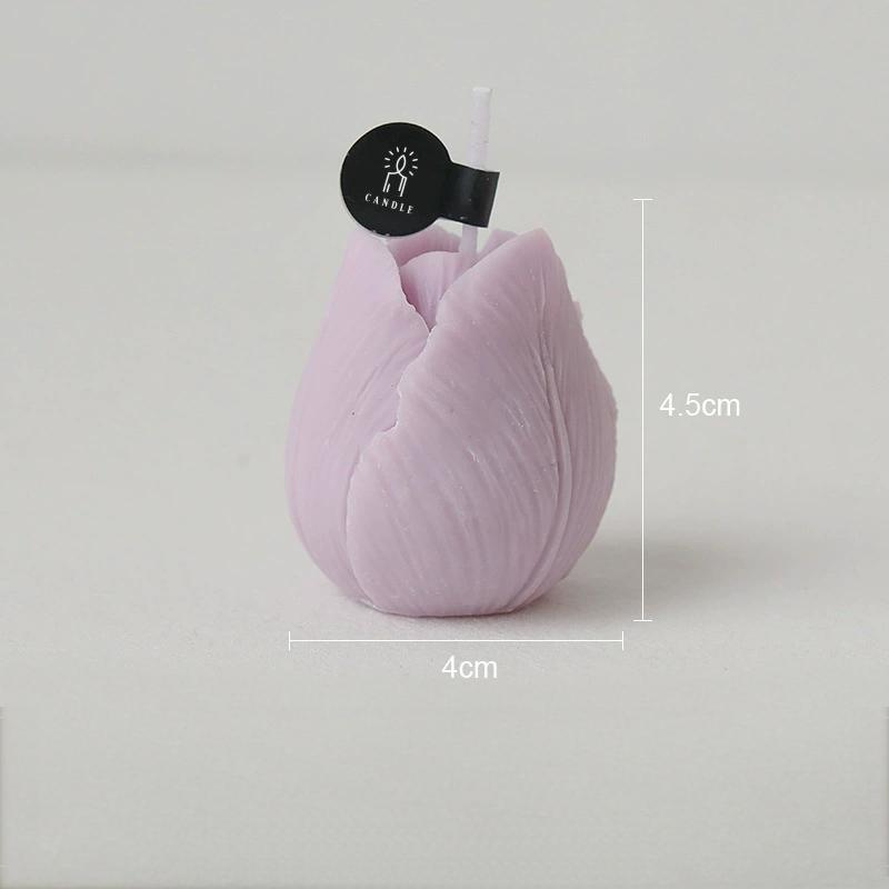 Close-up of lilac tulip shaped candle showing detailed petal texture and size reference.