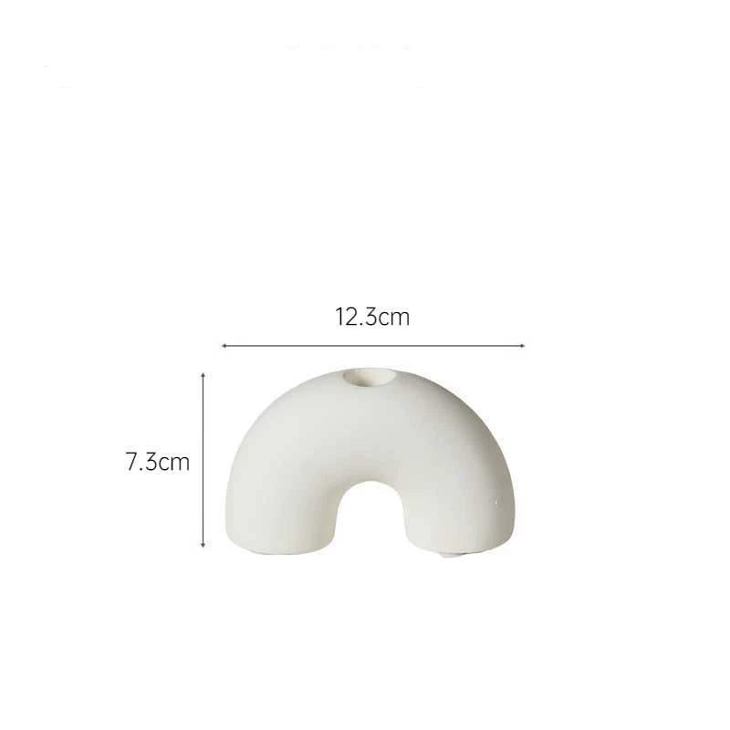 White ceramic candle holder with size lines indicating 12.3cm width and 7.3cm height