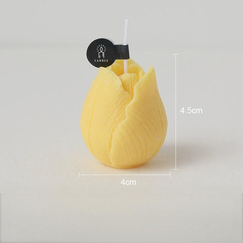Yellow tulip shaped candle with prominent petal design and size indices.