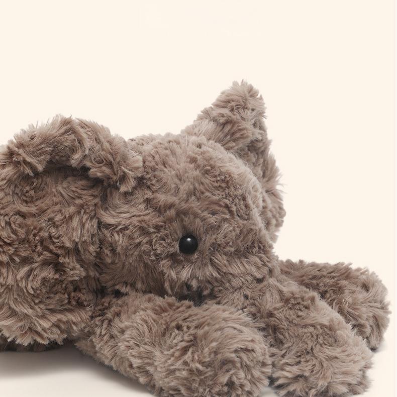  Close-up of elephant plush’s gentle face and detailed soft fur