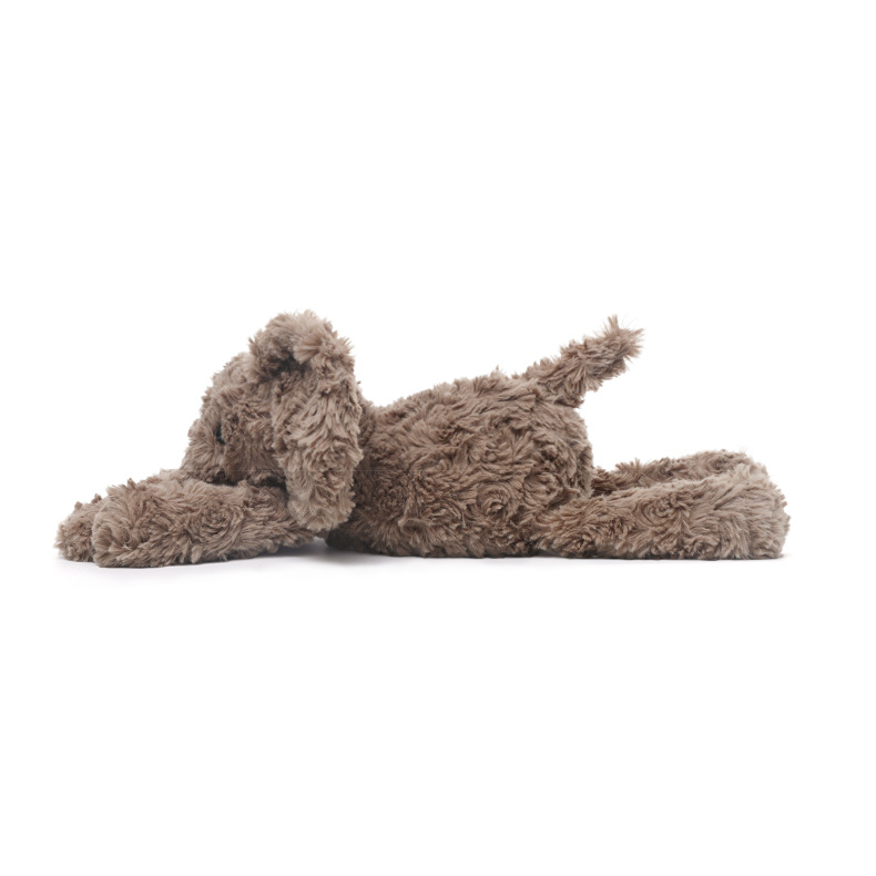 Side profile of elephant laying plush toy, showing its cuddly elongated design