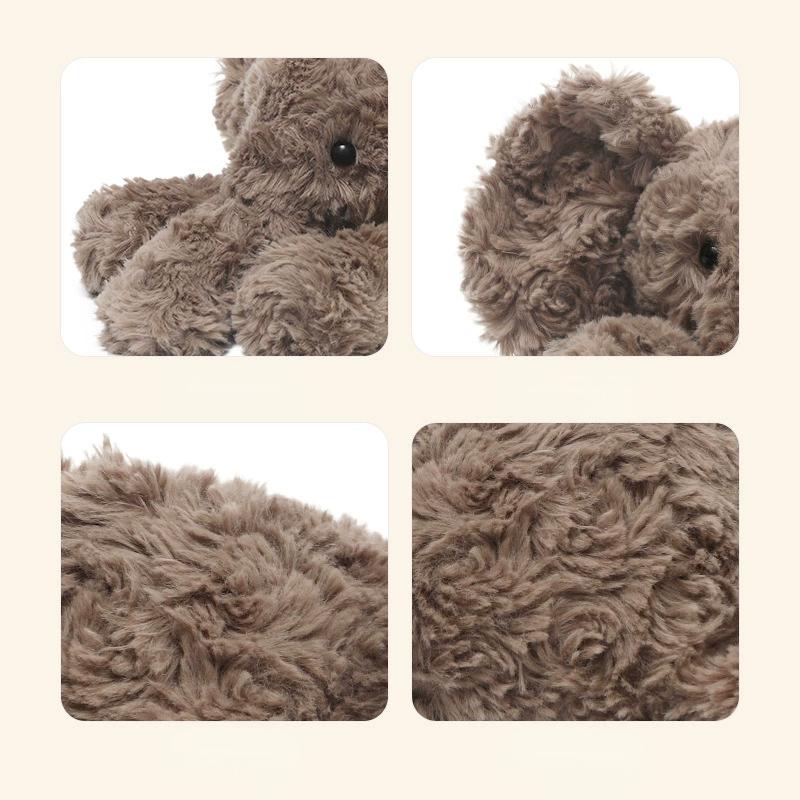 Elephant laying plush side view with size reference, showing its perfect huggable length