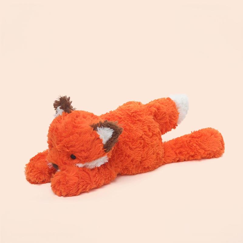 Fox laying plush in orange hue, embodying lively spirit and comforting touch