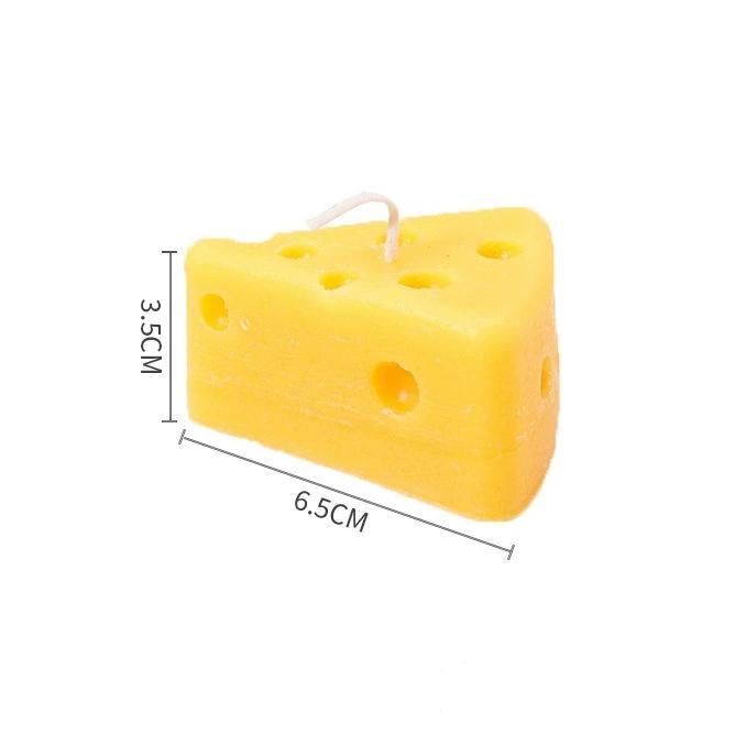 Dimension chart for a cheese wedge-shaped candle, showing 6.5cm length and 3.5cm height.