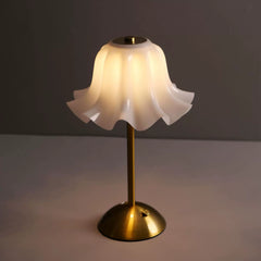 A detailed view of the Floral Grace Desk Lamp, focusing on the sleek stem and the accessible touch switch on its smooth, minimalist base.