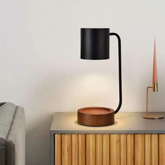 Minimalist candle warmer lamp with solid wood base on a modern side table, creating a serene ambiance