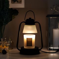Night view of vintage table lamp-style candle warmer illuminating a scented candle for emotional solace
