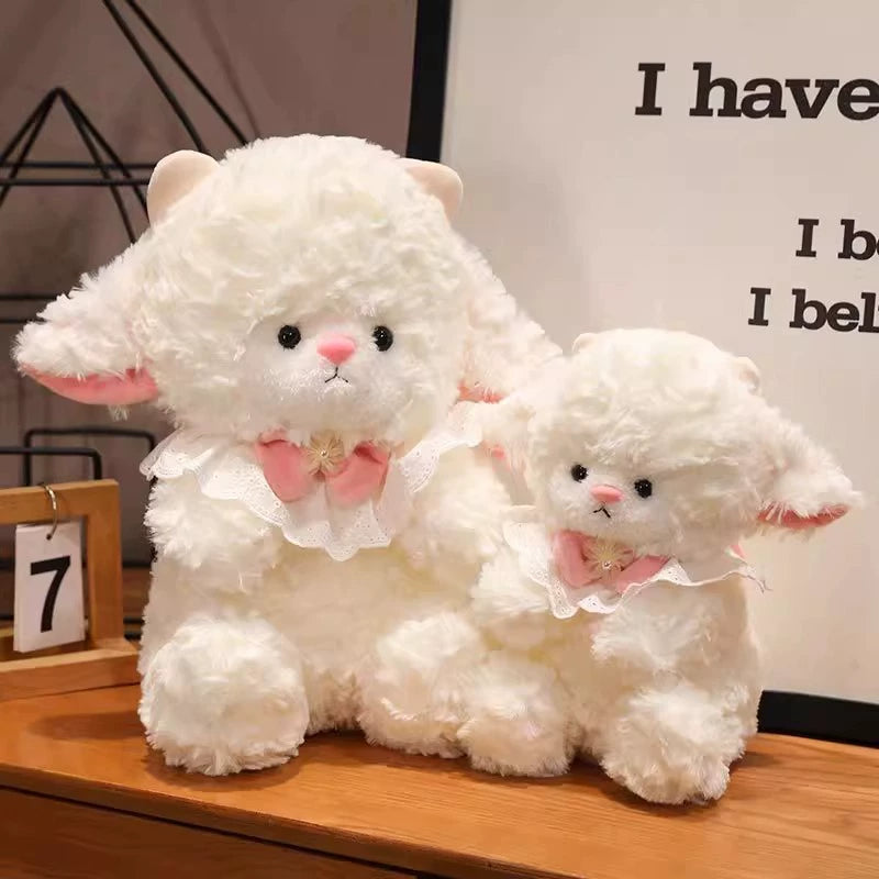 Two Princess Lamb Plush Toys displayed together on a wooden desk