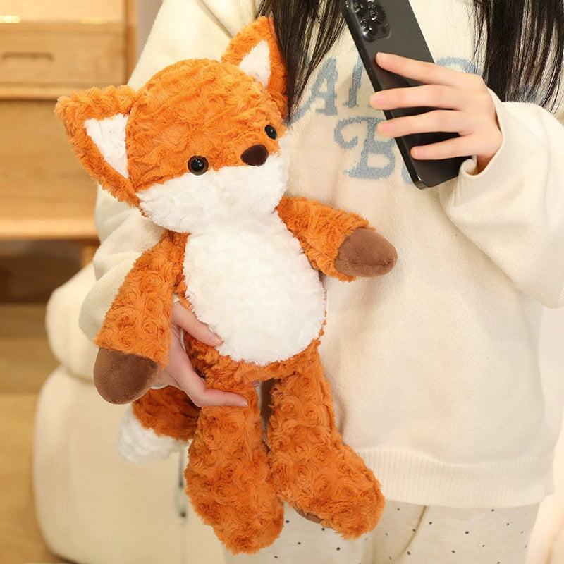 Running Fox Plush Toy being held close, highlighting its lightweight and soft material.
